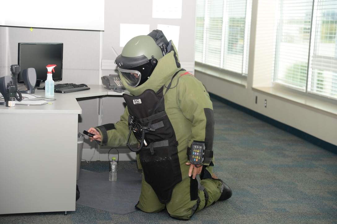 Naval Station Mayport’s Navy Explosive Ordnance Deposal Team’s technician uses a device to analyze the contents of a suspicious bag found after base officials receive a bomb threat during a full-scale exercise on the installation, recently. Mission Assurance Branch emergency officials and base personnel at Marine Corps Support Facility Blount Island, Jacksonville, Fla., mobilized a team of mutual aid partners to assess and successfully neutralize the threat.

