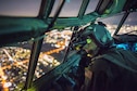 Capt. Thomas Bernard, a 36th Airlift Squadron C-130 Hercules pilot, performs a visual confirmation with night vision goggles during a training mission over the Kanto Plain, Japan, Oct. 14, 2015. Crews from Yokota Air Base, Japan, regularly conduct night flying operations to ensure they’re prepared to respond to a variety of contingencies throughout the Indo-Asia Pacific region. (U.S. Air Force photo/Osakabe Yasuo)
	
