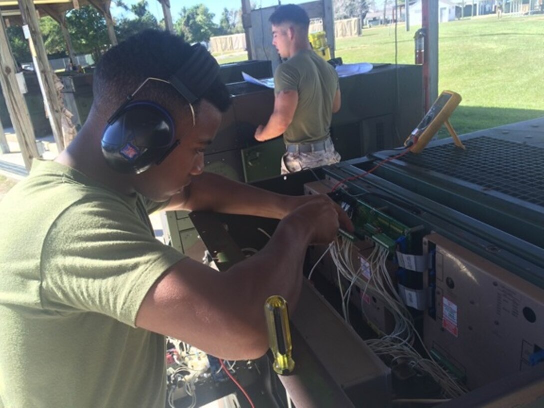 PFC Preshay Houston and LCpl Patrick O'Donnell from Basic Engineer Equipment Electrical Systems Technician 9-15 (BEEEST 9-15) conduct a practical application on troubleshooting the electrical system of a MEP-805B generator at Marine Corps Engineer School, Camp Lejeune, N.C. October 22, 2015.  This task is 1 of 17 the students must master in order to receive the 1142 Military Occupational Specialty (MOS).
