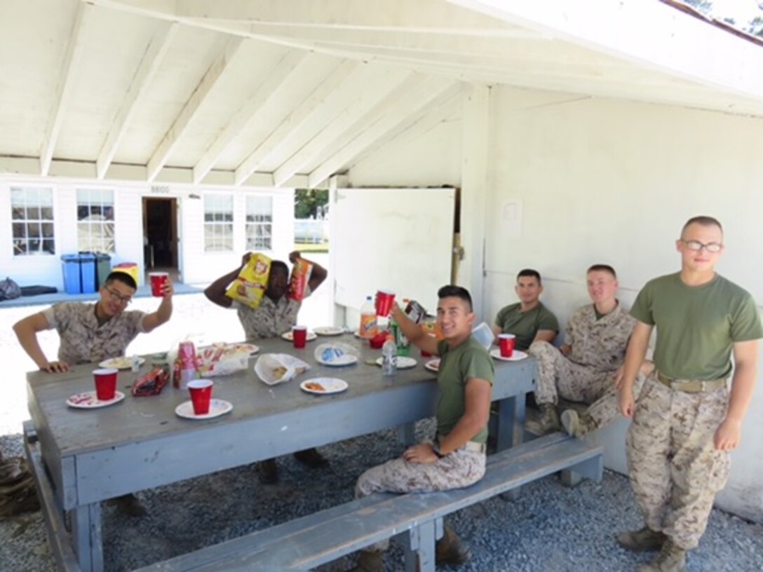 Marines from Basic Engineer Equipment Electrical Systems Technician 8-15 (BEEEST 8-15) celebrate their upcoming graduation with a class BBQ at Marine Corps Engineer School, Camp Lejeune, N.C. October 22, 2015.  The 19 Students completed and mastered each of the 17 tasks required to receive the 1142 Military Occupational Specialty (MOS).