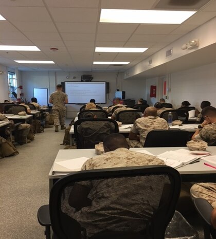 Marines attending Basic Electrician course 1-16 (BE 1-16) are tested on their ability to use a Technical Manual (TM) and navigate through its various portions aboard Camp Lejeune, North Carolina at Marine Corps Engineer School. 

