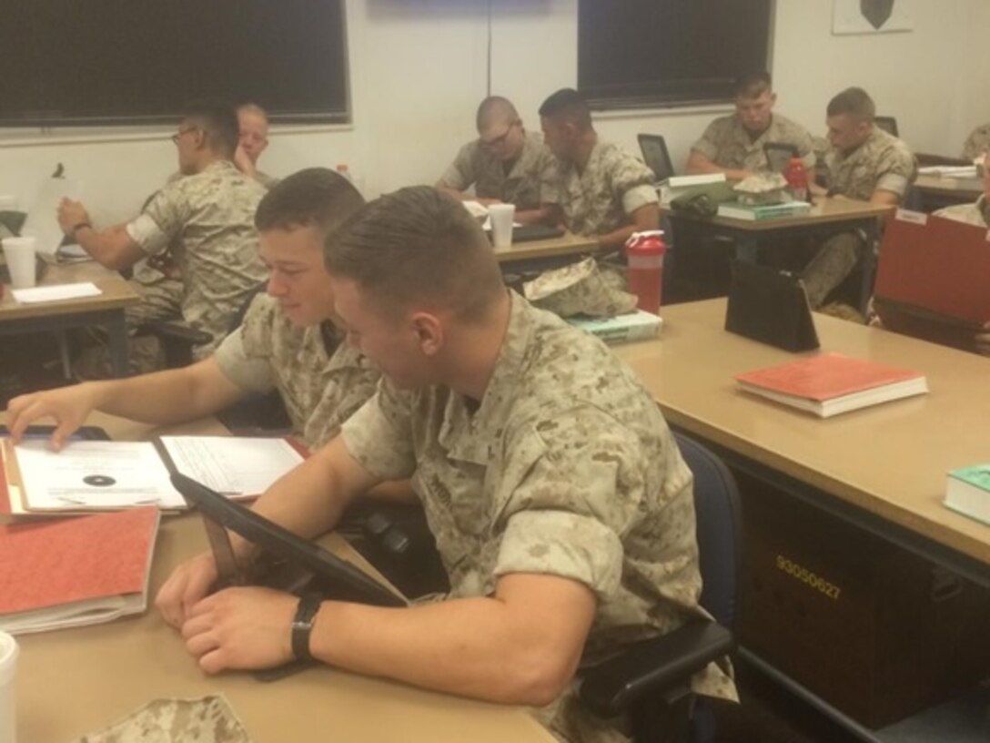 Marines from Basic Refrigeration Air Conditioning Technician course 6-15 (BRACT 6-15) learn about various technical manuals and how to navigate through its contents as part of the technical manuals class at Marine Corps Engineer School, Camp Lejeune, N.C. October 22, 2015.  This task is one of ten the students must master in order to receive the 1161 Military Occupational Specialty (MOS).
