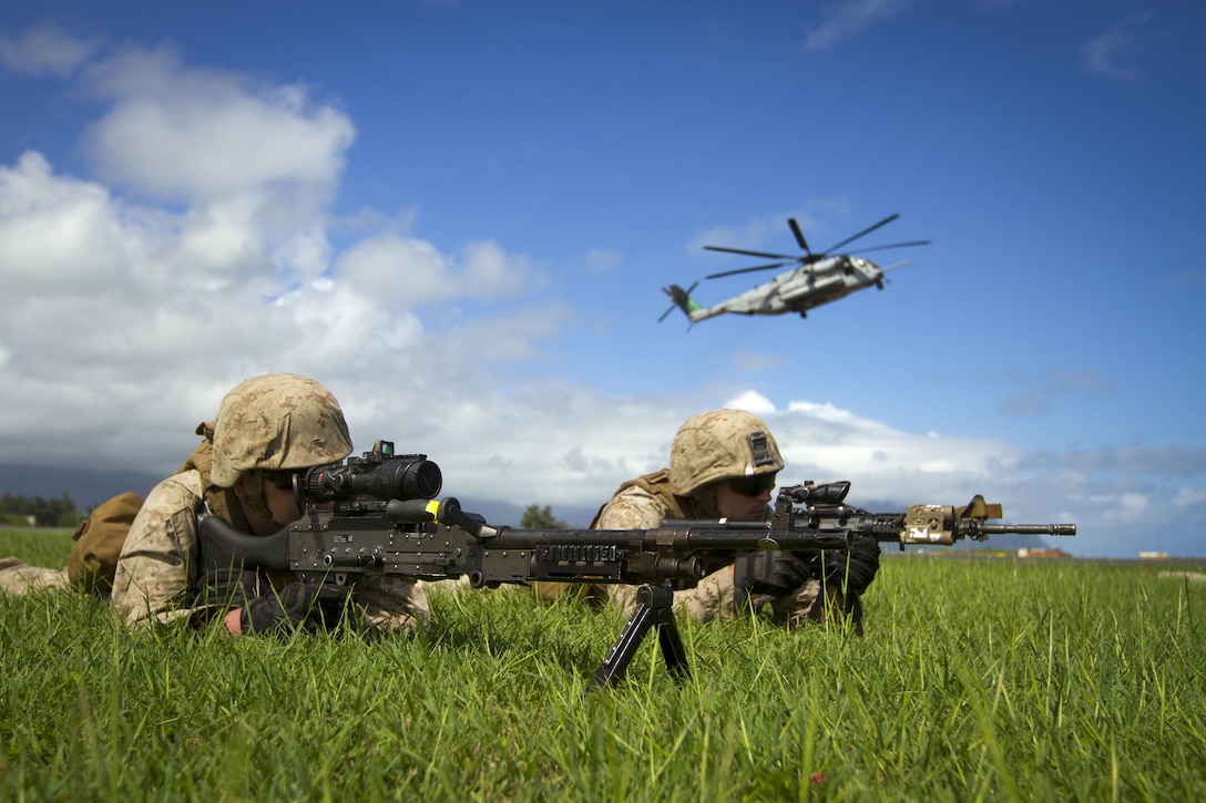 Marines provide security during an Air-Ground Task Force demonstration at the Kaneohe Bay Air Show on Marine Corps Air Station Kaneohe Bay in Hawaii, Oct. 18, 2015. U.S. Marine Corps photo by Lance Cpl. Aaron S. Patterson  