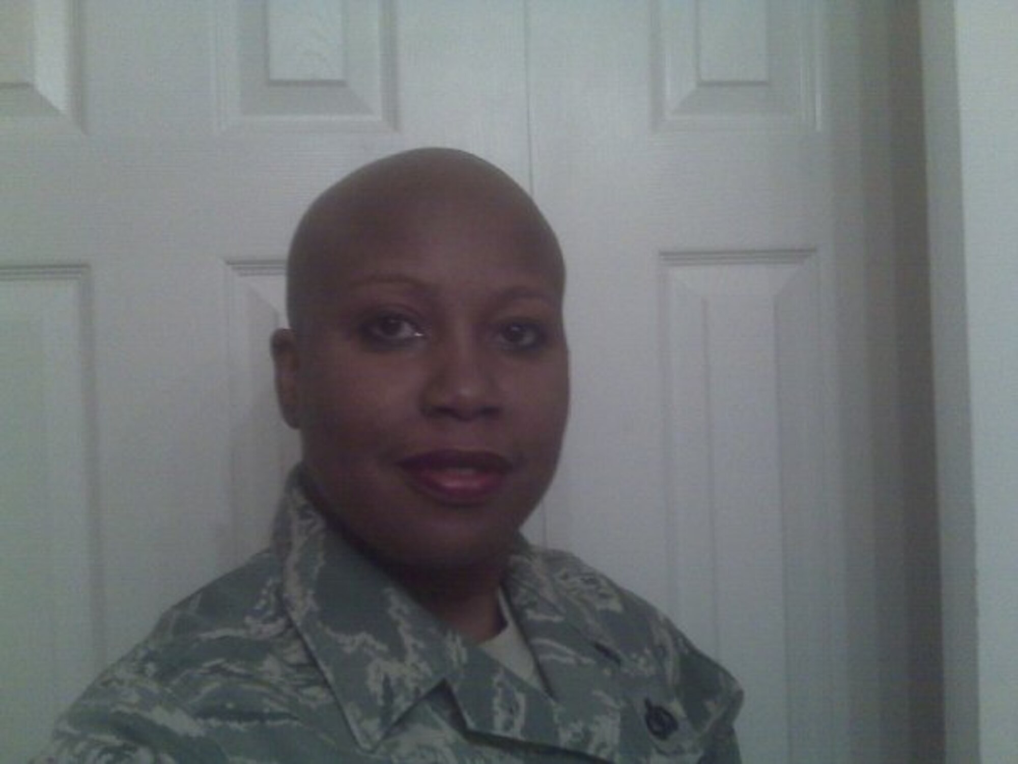 The results of Chief Master Sgt. Yolanda Jennings’ chemotherapy treatment, when she had just taken her wig off for the first time at work. (Courtesy photo)