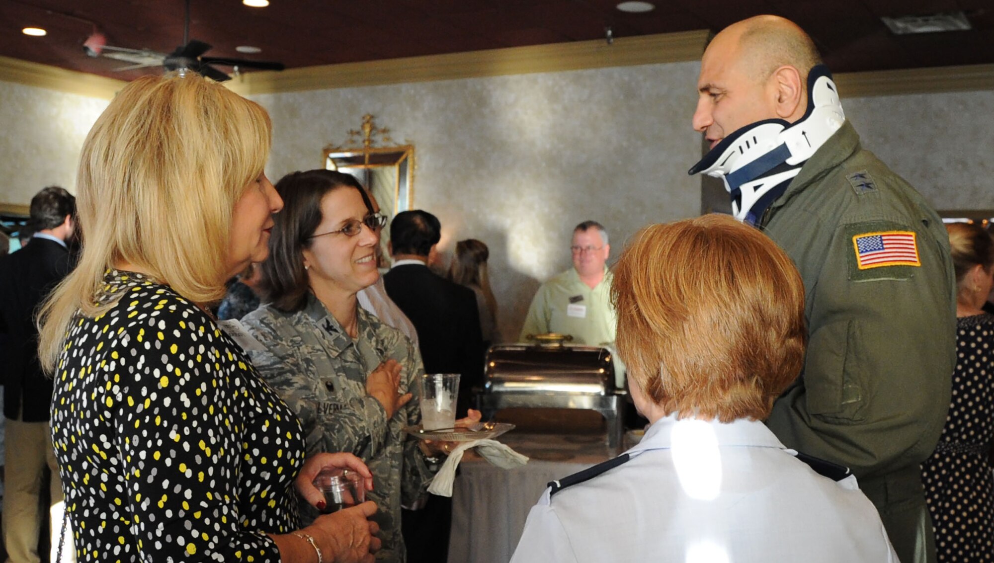 Maj. Gen. Richard S. “Beef” Haddad, Air Force Reserve Command vice commander, and his wife, Ginger, converses with military leaders during the Business After Hours event hosted by the Robins Regional and Perry Chambers of Commerce Oct. 22 in Perry, Ga. The events are held periodically by both chambers to allow community, business and military leaders to network and fellowship. (U.S. Air Force photo/Tech Sgt. Mercedes Crossland)