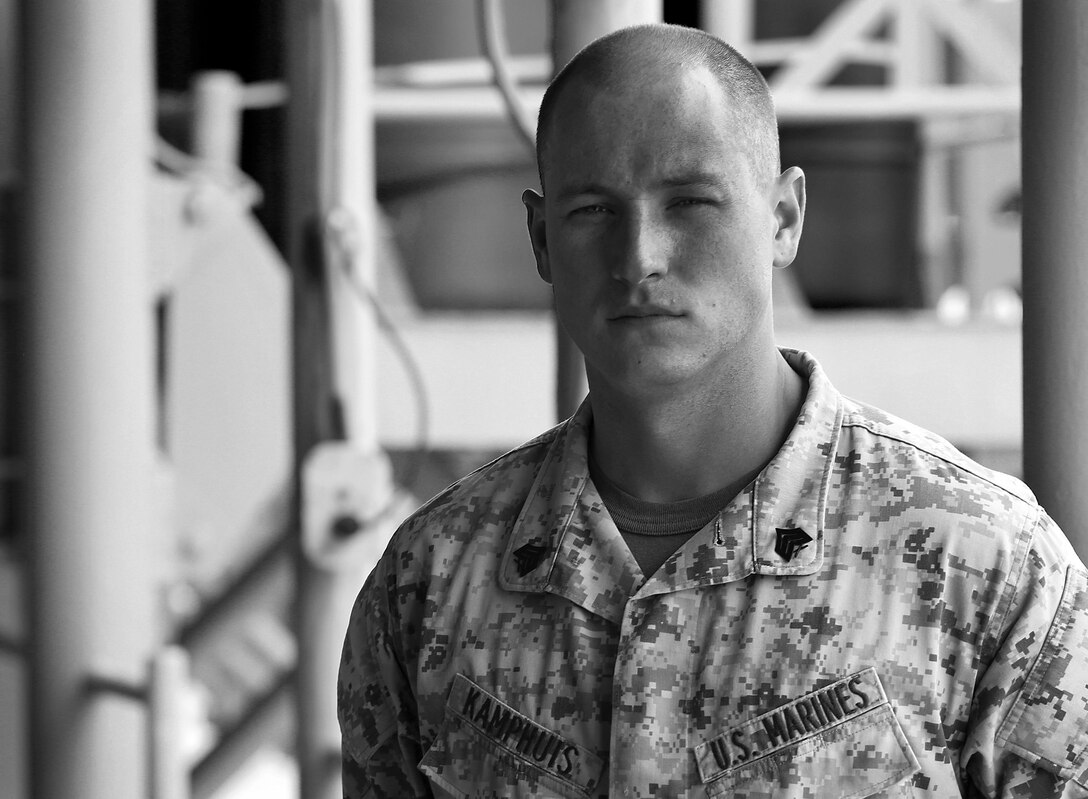 Marine Corps Sgt. Jan Kamphuis, an air traffic controller with Marine Medium Tiltrotor Squadron 162, poses Oct. 10, 2015, aboard the USS Kearsarge. Kamphuis is the most recent recipient of the Sgt. Maj. Frederick B. Douglass award, given annually by the Marine Corps League to the Marine who demonstrates superior qualities in the Marine Corps aviation community. U.S. Marine Corps photo illustration by Cpl. Joshua W. Brown