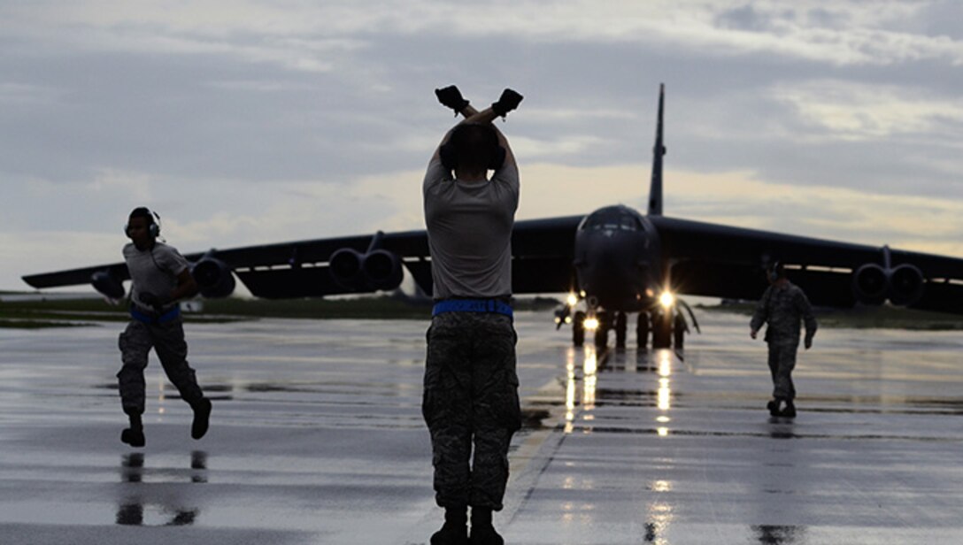 Airman 1st Class Michael Banks, 20th Expeditionary Bomb Squadron aircrew flight equipment specialist, packages a B-52 Stratofortress drag chute Aug. 12, 2015, at Andersen Air Force Base, Guam. Drag chutes safely slow aircraft upon landing and are essential safety equipment. (U.S. Air Force photo by Staff Sgt. Alexander W. Riedel/Released)