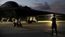 An aircraft maintainer with the 509th Aircraft Maintenance Squadron assists with the launch of a B-2 Spirit at Andersen Air Force Base, Guam, Aug. 12, 2015. Three B-2s and about 225 Airmen from Whiteman Air Force Base, Missouri, deployed to Guam to conduct familiarization training activities in the Indo-Asia-Pacific region. (U.S. Air Force photo by Senior Airman Joseph A. Pagán Jr./Released)