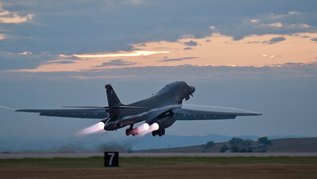 A B-1 bomber rumbles down the flightline at Ellsworth Air Force Base, S.D. , July 24, 2012 as part of a training mission. Each of the B-1’s four engines is capable of producing 30,000-plus pounds of thrust. (U.S. Air Force photo by Airman 1st Class Zachary Hada/Released)
