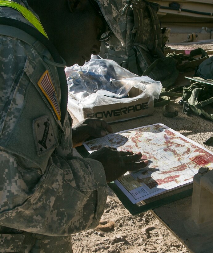 A soldier maps out the route during Decisive Action Rotation 16-01 on Fort Irwin, Calif., Oct. 9, 2015. U.S. Army photo by Sgt. Richard W. Jones Jr.