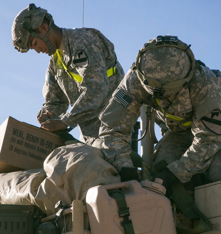 Soldiers secure gear to their vehicles during Exercise Decisive Action Rotation 16-01 on Fort Irwin, Calif., Oct. 9, 2015. U.S. Army photo by Sgt. Richard W. Jones Jr.
