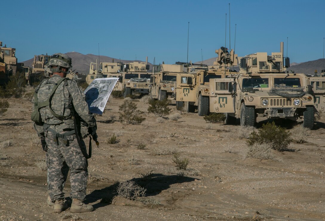 Soldiers plan the follow-on route during Exercise Decisive Action Rotation 16-01 on Fort Irwin, Calif., Oct. 9, 2015. U.S. Army photo by Sgt. Richard W. Jones Jr.