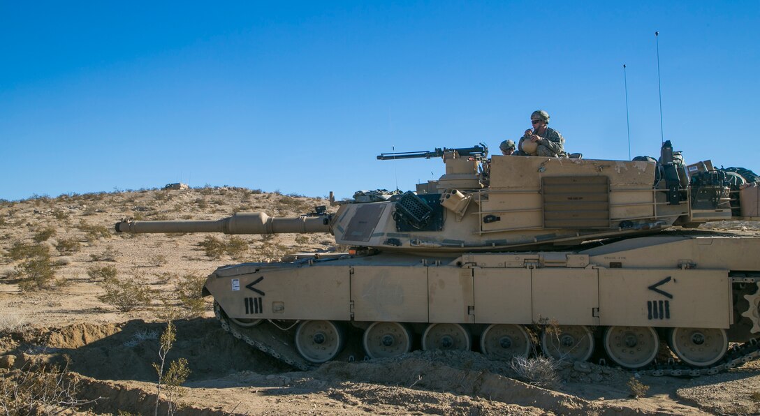 Soldiers manning M1A1 Abrams tank provide security during Decisive Action Rotation 16-01 on Fort Irwin, Calif., Oct. 9, 2015. U.S. Army photo by Sgt. Richard W. Jones Jr.