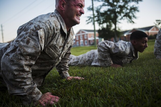 Pfc. Brandon Tressler, scout sniper screener candidate from 3rd Battalion, 6th Marine Regiment, conducts a max set of push-ups after completing a 1.5 mile ruck run at Camp Lejeune, N.C., Oct. 20, 2015. The screener aims to prepare candidates for the Scout Sniper Basic Course. (U.S. Marine Corps photo by Cpl. Kirstin Merrimarahajara/ released)