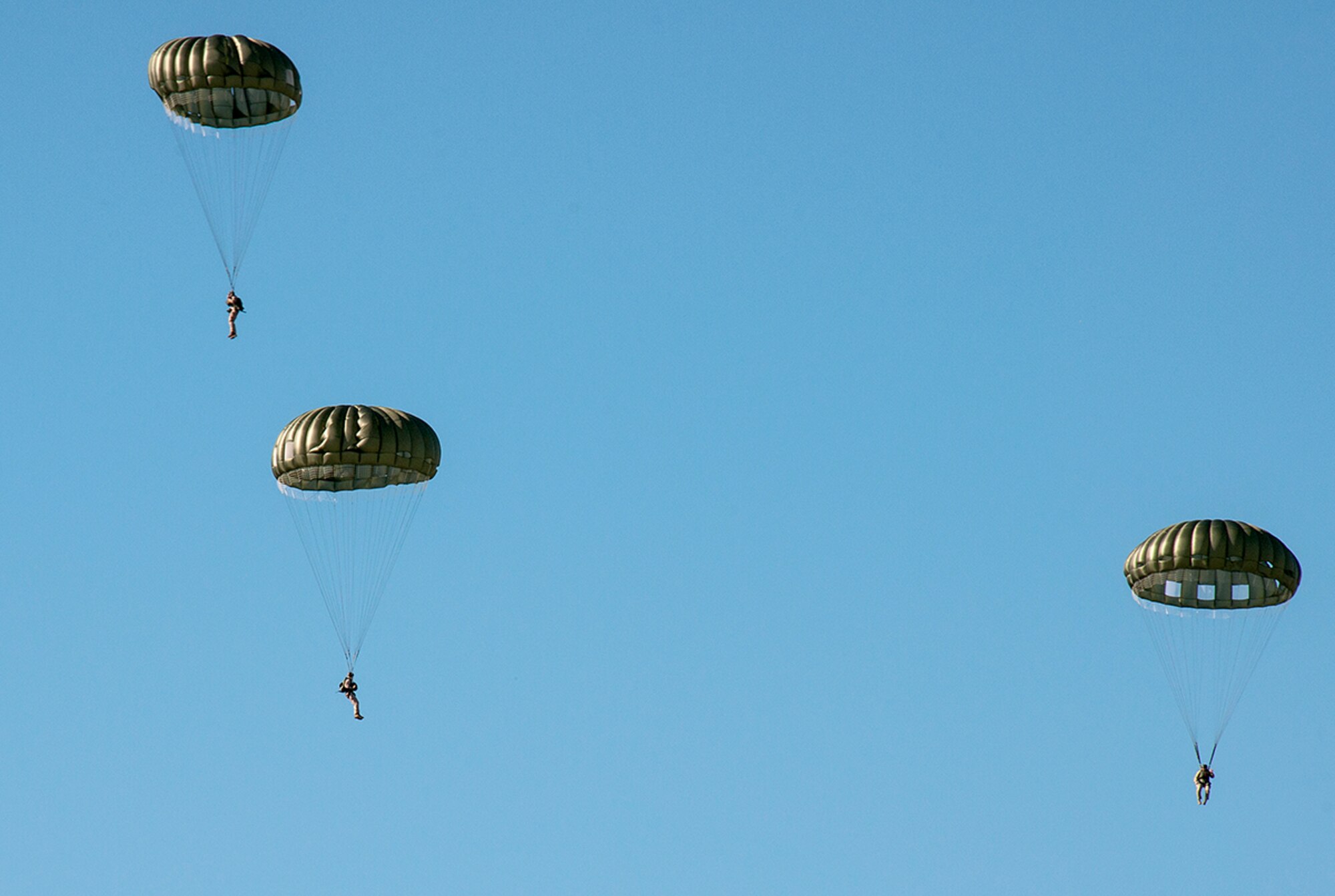 Marines from the 4th Recon Battalion Bravo Company parachute from an U.S. Air Force C-130 Hercules over the Dobbins Air Reserve Base, Ga. Oct. 15, 2015. The 700th Airlift Squadron performed personnel drops working with 4th Recon Battalion Bravo Company. This exercise marked the first time in four years that these units had worked together for parachutes jumps. (U.S. Air Force photo/ Staff Sgt. Daniel Phelps)