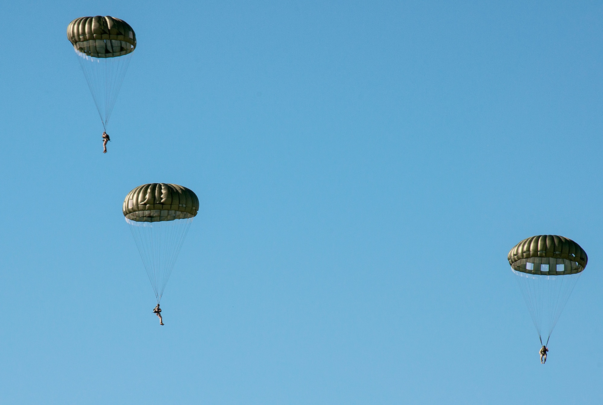 Marines from the 4th Recon Battalion Bravo Company parachute from an U.S. Air Force C-130 Hercules over the Dobbins Air Reserve Base, Ga. Oct. 15, 2015. The 700th Airlift Squadron performed personnel drops working with 4th Recon Battalion Bravo Company. This exercise marked the first time in four years that these units had worked together for parachutes jumps. (U.S. Air Force photo/ Staff Sgt. Daniel Phelps)