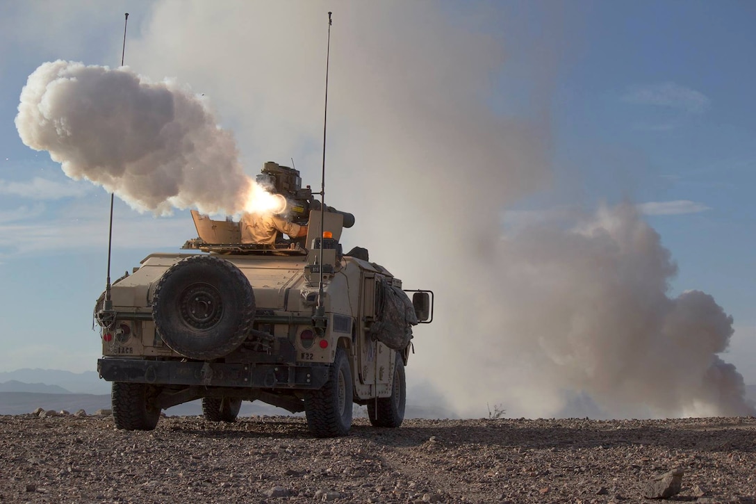 A soldier fires a missile system during Decisive Action Rotation 16-1 at the National Training Center on Fort Irwin, Calif., Oct. 17, 2015. The soldier is assigned to 11th Armored Cavalry Regiment. U.S. Army photo taken by Spc. Taria Clayton