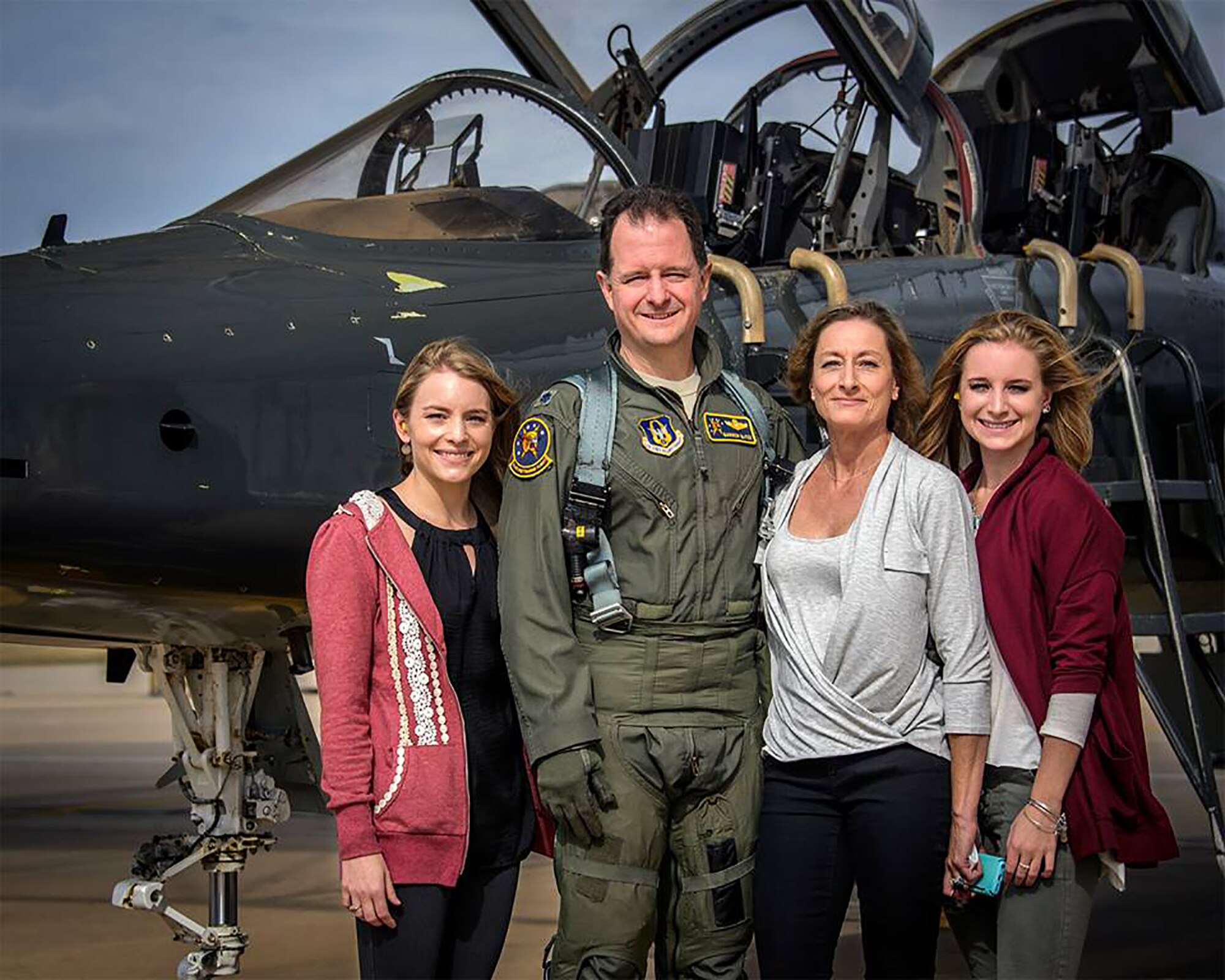 Lt Col. Darren "Shead" McTee poses with his family prior to his final flight with the 5th Flying Training Squadron at Vance Air Force Base, Okla. (Courtesy photo)
