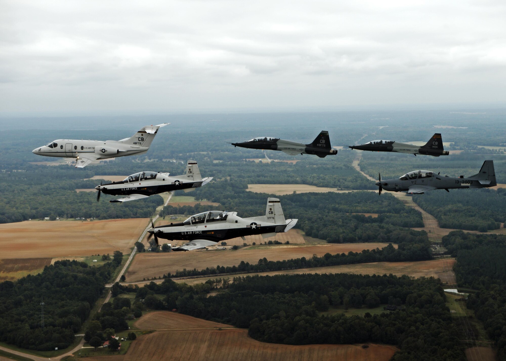 An aircraft from each of the 14th Flying Training Wing flying squadrons were represented in a dissimilar formation in the vicinity of Columbus Air Force Base, Mississippi Oct.1, 2015. This is the first flight to feature the A-29 Super Tucano from the 81st Fighter Squadron at Moody Air Force Base, Georgia, Columbus AFB’s geographically separated squadron. (U.S. Air Force photo/Airman 1st Class Daniel Lile)