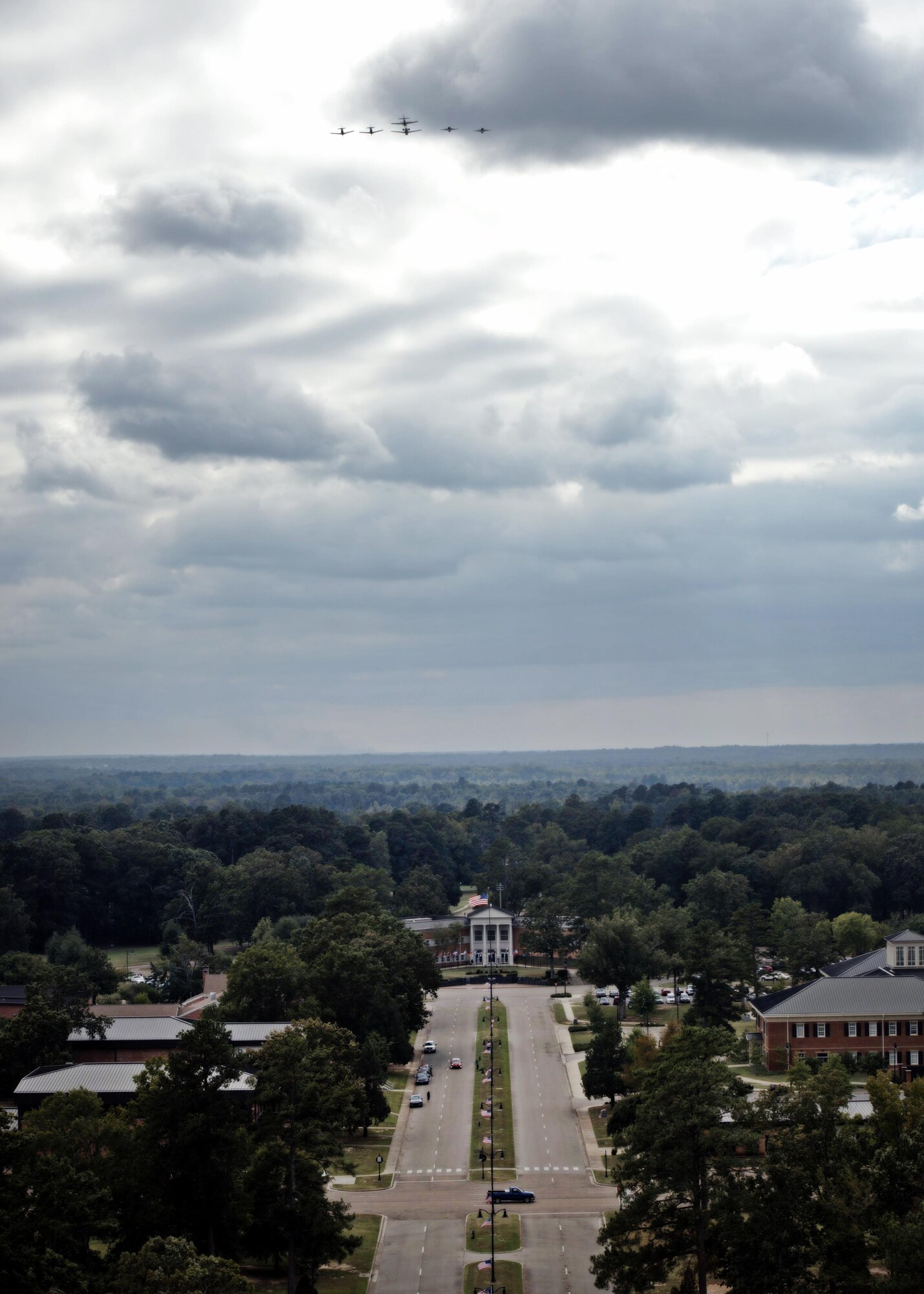 An aircraft from each of the 14th Flying Training Wing flying squadrons were represented in a dissimilar formation above Columbus Air Force Base, Mississippi Oct.1, 2015. In addition to passing over the flightline multiple times, the formation flew down Harpe St., just above the Wing Headquarters. (U.S. Air Force photo/Airman 1st Class John Day)