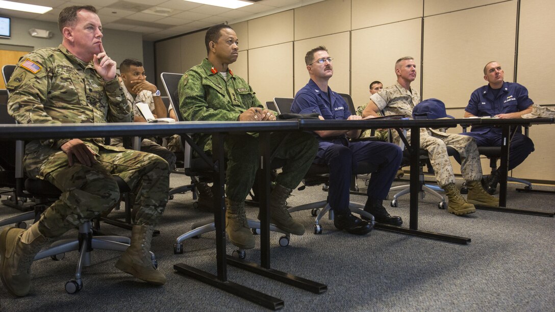 Leaders from 2nd Marine Division, II Marine Expeditionary Force, U.S. Marine Forces-South and the Belize Defence Force participate in a roundtable discussion at II MEF, Marine Corps Base Camp Lejeune, N.C., Oct. 22, 2015. The purpose of the visit was to assess the capabilities of U.S. forces, discern opportunities for Belize forces to train alongside Marines and sustain enduring partnerships between the two countries in their efforts to counter transnational organized crime. (From left to right: U.S. Army Lt. Col. Robert Ramsey, U.S. military liaison officer; Brig. Gen. David Jones, commander of the Belize Defence Force; U.S. Coast Guard Capt. Jonathon Riffe, commanding officer of the Special Missions Training Center; U.S. Marine Corps Brig. Gen. Eric Smith, commander of U.S. Marine Forces-South; U.S. Coast Guard Cmdr. Matthew Baer, executive officer of the Special Missions Training Center.) 