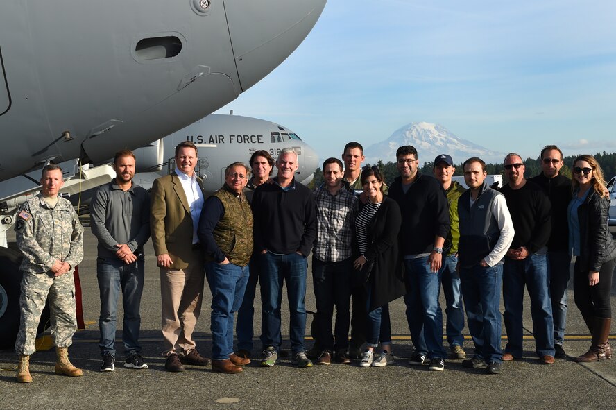 Gen Next members and Joint Base Lewis-McChord personnel stand in front of a C-17 Globemaster III on the McChord Field flight line Oct. 22, 2015 at Joint Base Lewis McChord, Wash. The tour gave Gen Next, an opportunity to create a better relationship with JBLM and gave them a more in depth look at the mission capabilities of the 62nd Airlift Wing. (Air Force Photo/Senior Airman Naomi Griego)