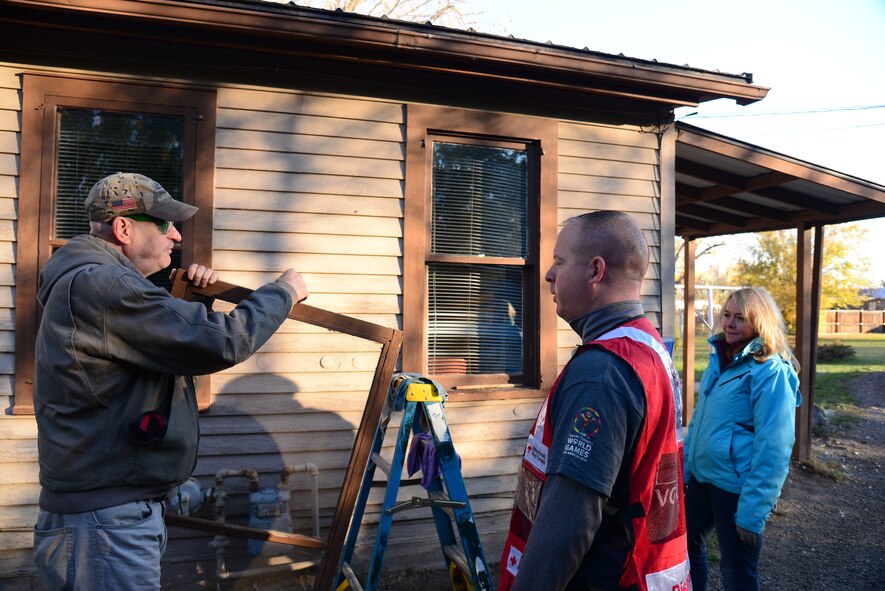 Airmen from Malmstrom Air Force Base and federal employees volunteer to perform household chores and install smoke detectors for the Day of Caring Oct. 23, 2015, in the Great Falls, Mont., community. A total of 300 homes were visited where household chores were performed, with 250 of those homes receiving smoke alarm installations and maintenance. (U.S. Air Force photo/Airman 1st Class Magen M. Reeves)