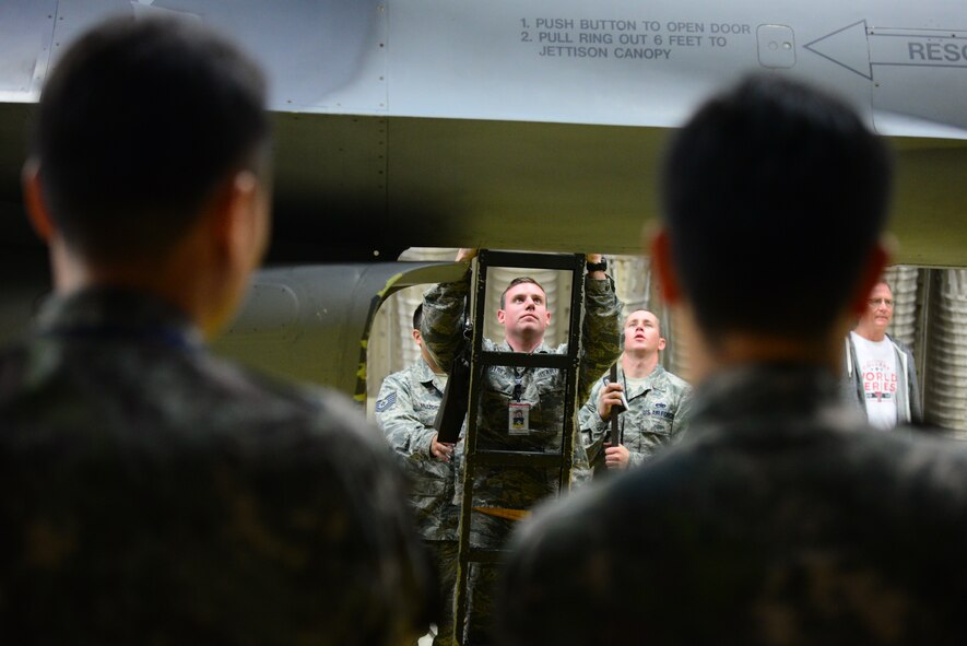 Staff Sgt. Justin Gautreau, 51st Maintenance Group quality assurance manager, assists in running a weight and balance test an a F-16 Fighting Falcon as members of the Republic of Korea Air Force observe at Osan Air Base, Republic of Korea, Oct. 14, 2015. The ROKAF joined up with U.S. Air Force quality assurance technicians to learn how to properly weigh and balance aircraft systems.
(U.S. Air Force photo/Staff Sgt. Amber Grimm)