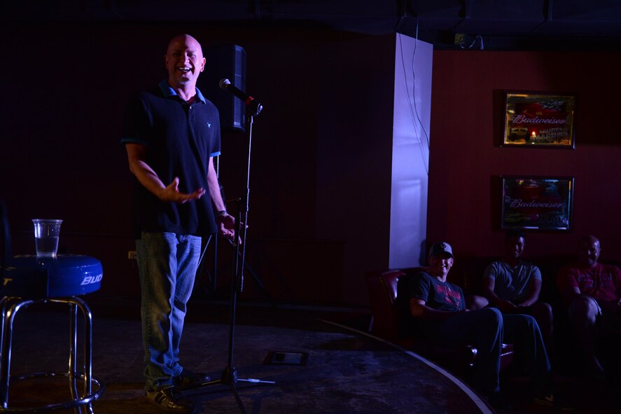 Don Barnhart, a stand-up comedian, tells a joke to more than 70 service members and their families Oct. 21, 2015, at Andersen Air Force Base, Guam. Barnhart is part of an Armed Forces Entertainment-sponsored comedy group touring military installations to improve morale and bring laughter to the troops. (U.S. Air Force photo by Airman 1st Class Alexa Ann Henderson/Released)