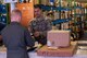 U.S. Air Force Senior Airman Adam Vandyke, 18th Communications Squadron postal clerk, assists Capt. Alex Khutoryan, 961st Airborne Air Control Squadron deputy chief of weapons and tactics, with his parcel at the Kadena Post Office Oct. 22, 2015, on Kadena Air Base, Japan. As the holidays draw closer, customers are asked to check their mailboxes daily to ensure there is room for the influx of packages expected to arrive on island over the next few months. (U.S. Air Force photo by Airman Zackary A. Henry)