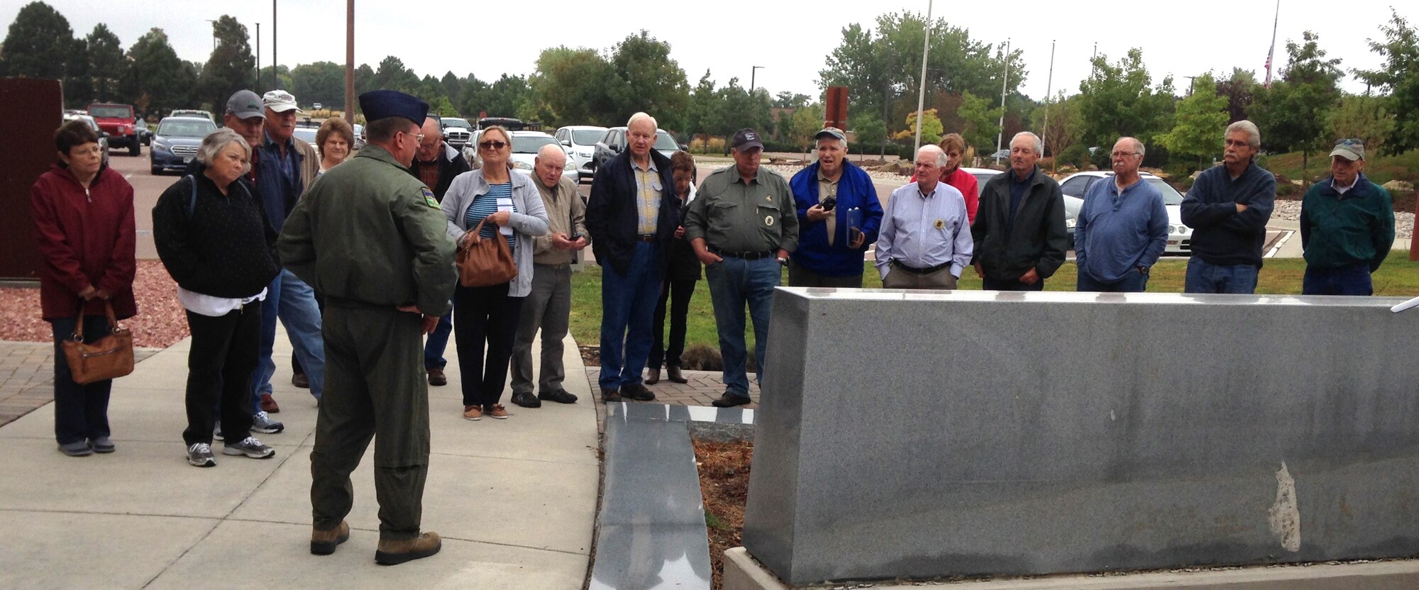 PETERSON AIR FORCE BASE, Colo. Members and family members of the 70-06 pilot training class, Craig AFB visited the 302nd Airlift Wing Saturday, Oct. 3, 2015 as part of their 45th reunion. The group paid their respects at the SUMIT 38 memorial and received a wing mission brief by Chief Master Sgt. Dave Carey, chief engineer, pictured, as well as a briefing from NORAD/NORTHCOM at the base museum. (Courtesy photo)