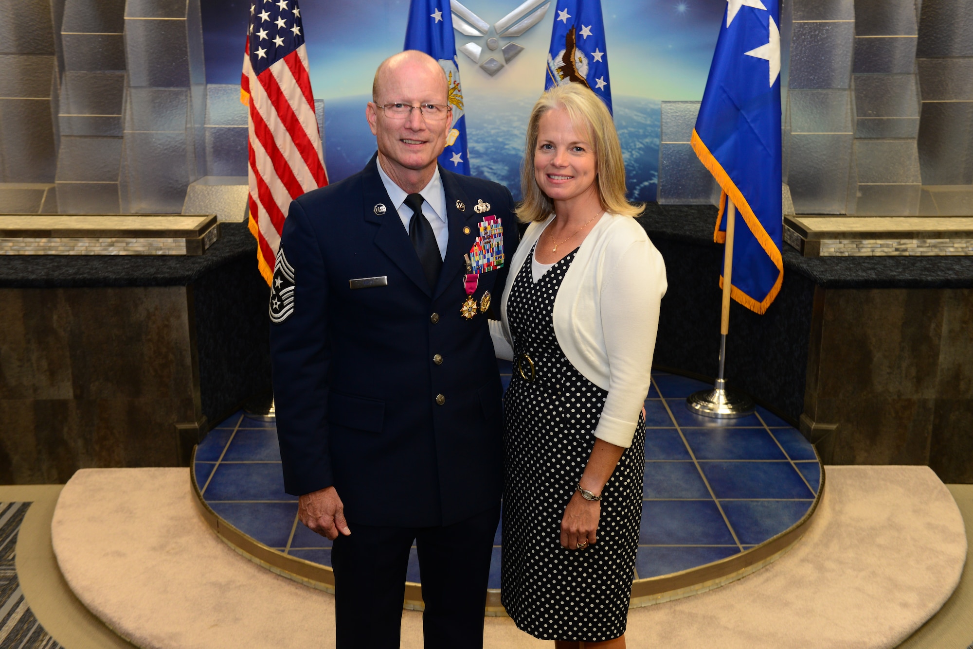 Chief Master Sgt. Terry West, former Air Force Global Strike command chief, is joined by his wife, Cindy, after his retirement ceremony at Barksdale Air Force Base, La., Oct. 22, 2015. West ended his 30-year career at AFGSC, where he advised senior leaders on matters affecting professional development, training, combat readiness, utilization, morale and mission effectiveness of the command’s Airmen.. (U.S. Air Force photo/Airman 1st Class Luke Hill)