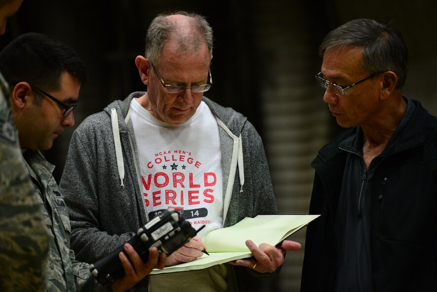 Tech. Sgt. Brandon Mulford, 51st Maintenance Group quality assurance manager along with Lockheed Martin representatives review data gathered during the hands-on portion of a weight and balance course taught at Osan Air Base, Republic of Korea, Oct. 14, 2015. The class trained both ROK and U.S.  quality assurance Airmen on specialized aircraft systems, which checks and measure the weight and balance of an aircraft.  
(U.S. Air Force photo/Staff Sgt. Amber Grimm)