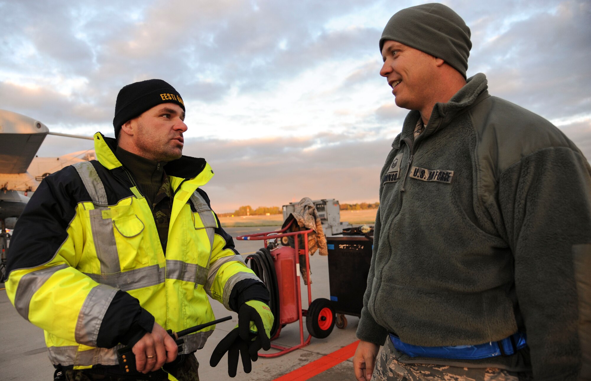 Estonian air force maintainers work together to deice the wing of an 74th Expeditionary Fighter Squadron A-10 Thunderbolt II attack aircraft assigned to the 23d Wing at Moody Air Force Base, Georgia, on the flightline at Amari Air Base, Estonia, Oct. 8, 2015. The operation was the first time the Estonian maintainers used the deicing equipment outside of training. (U.S. Air Force photo by Andrea Jenkins/Released)