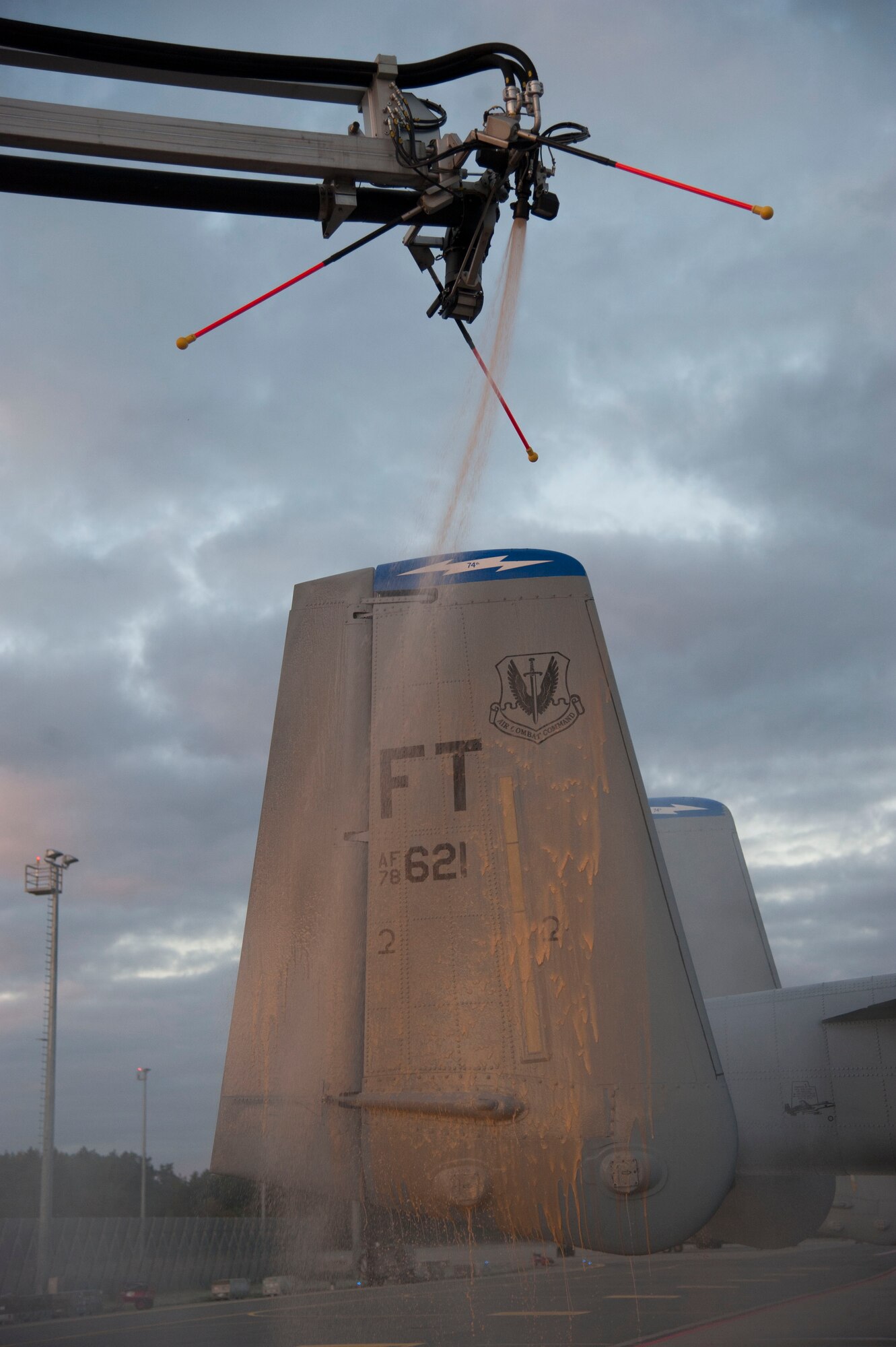 Estonian air force maintainers deice the wing of a 74th Expeditionary Fighter Squadron A-10 Thunderbolt II attack aircraft assigned to the 23d Wing at Moody Air Force Base, Georgia, on the flightline at Amari Air Base, Estonia, Oct. 8, 2015. Twelve A-10 aircraft and approximately 350 Airmen deployed as part of a Theater Security Package will spend the next several months working alongside their NATO allies in support of Operation Atlantic Resolve. (U.S. Air Force photo by Andrea Jenkins/Released)