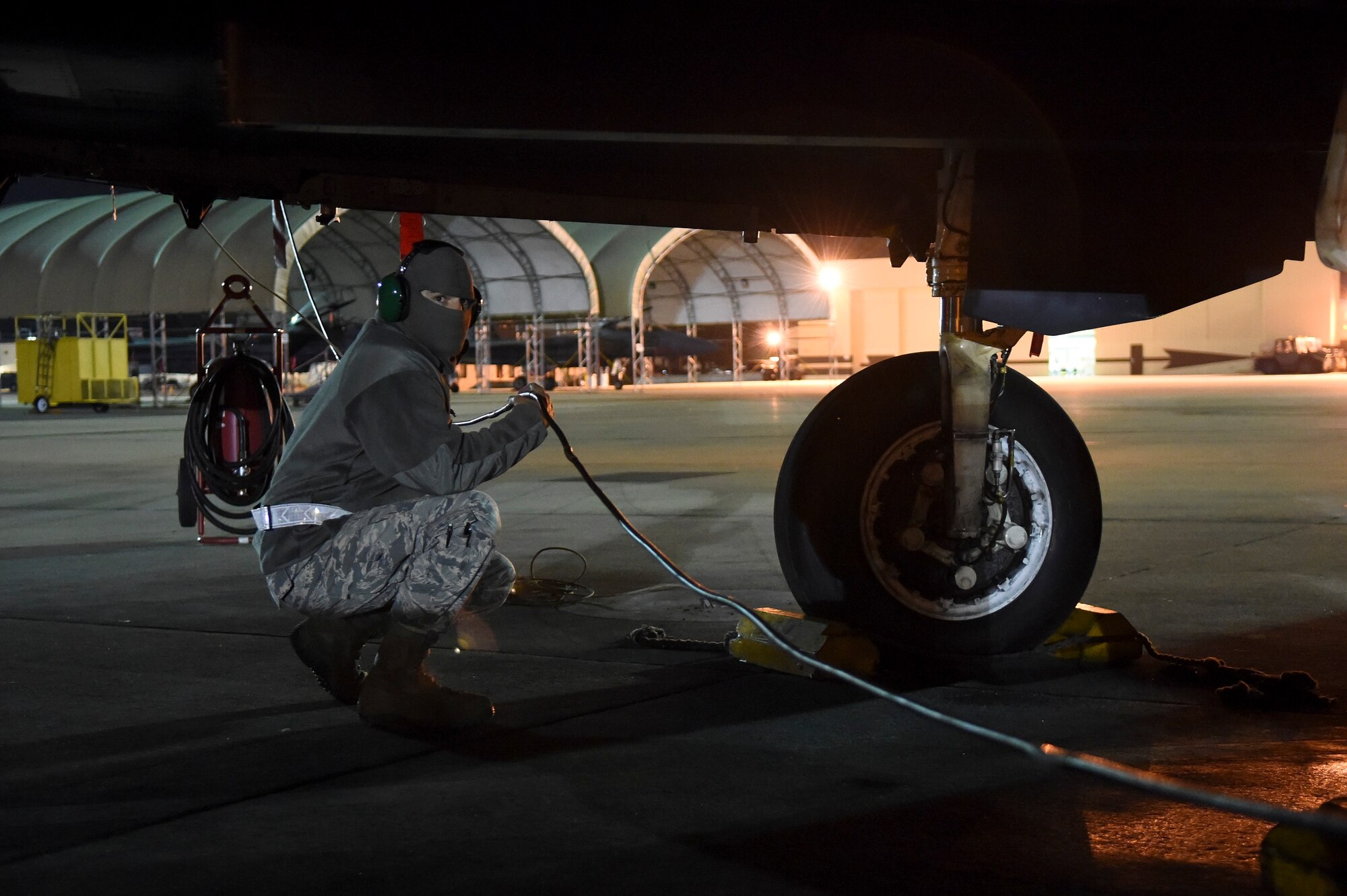 Staff Sgt. Jeremiah Johnson, a Combat Shield team member assigned to the 16th Electronic Warfare Squadron, Eglin Air Force Base, Florida, supports a USM-642 “Raven” signal generator cable during Combat Shield, Oct. 20, 2015, at Seymour Johnson Air Force Base, North Carolina. Combat Shield originated in the early 1990s with the purpose of assessing the electronic warfare readiness of the entire fighter fleet. (U.S. Air Force photo/Senior Airman Aaron J. Jenne)