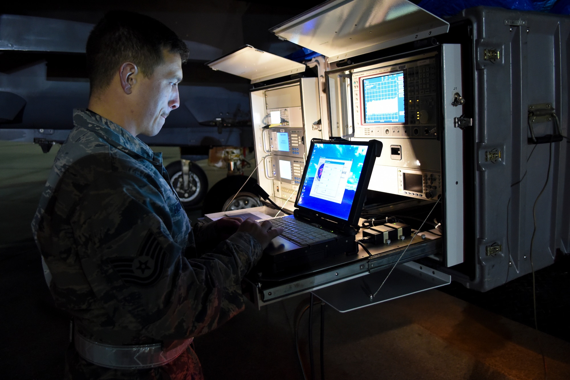 Tech. Sgt. Matthew Hoover, a Combat Shield crew leader assigned to the 16th Electronic Warfare Squadron, Eglin Air Force Base, Florida, monitors a USM-642 “Raven” signal generator during Combat Shield, Oct. 20, 2015, at Seymour Johnson Air Force Base, North Carolina. Hoover used the USM-642 to simulate real-world radar emissions and test the sensitivity of the threat detection systems of an F-15E Strike Eagle.
(U.S. Air Force photo/Senior Airman Aaron J. Jenne)
