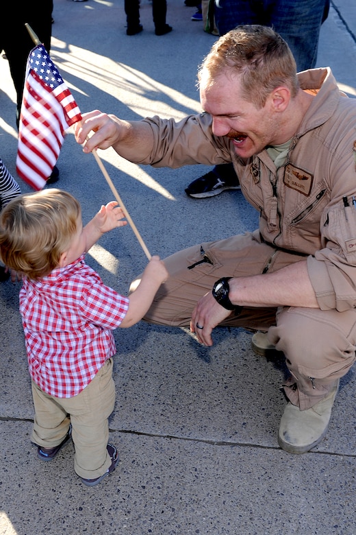 151022-Z-EZ686-368 – A pilot with the 127th Wing's 107th Fighter Squadron from Selfridge Air National Guard Base, Mich., reunites with his family after a six month deployment on October 22, 2015.  Ten A-10 Thunderbolt II aircraft returned from a six-month deployment to Southwest Asia in support of U.S. Central Command’s Operation Inherent Resolve.   (U.S. Air National Guard photo by Master Sgt. David Kujawa)