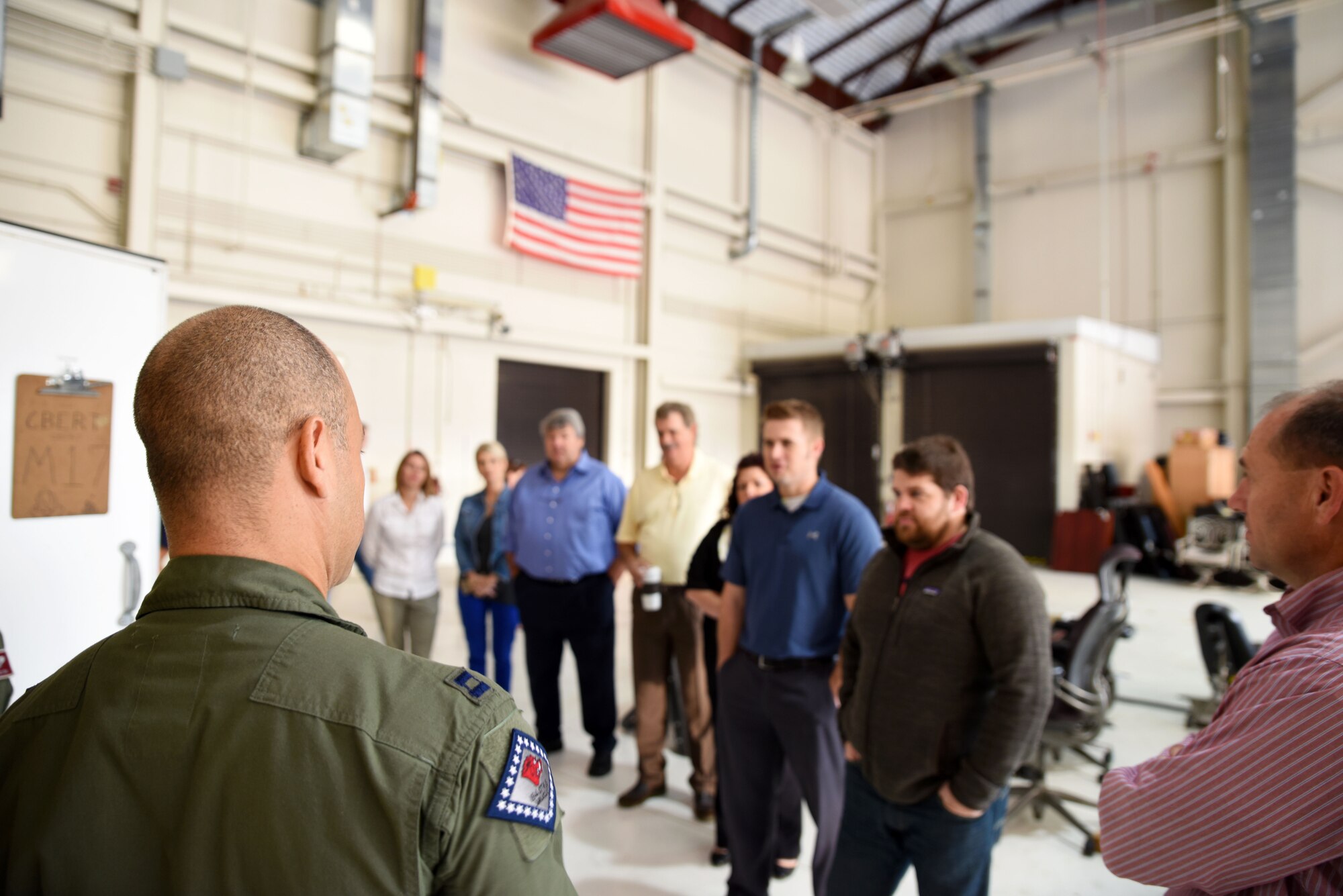 Members of Business by Referral group take part in a tour of the 188th Wing Oct. 22, 2015, where they participated in the predator reaper integrated mission environment (PRIME) simulator and were briefed on the capabilities of the remote air, zonal operations, reach back-processing, assessment and dissemination (RAZORBack PAD) at Ebbing Air National Guard Base, Fort Smith, Ark. The PRIME is a flight simulator that gives remotely piloted aircraft operators the opportunity to hone their skills during simulated missions. The RAZORBack PAD can assist disaster workers on the ground with video from overhead aircraft to provide information on areas or people most in need during emergency response planning and operations. (U.S. Air National Guard photo by Senior Airman Cody Martin/Released)