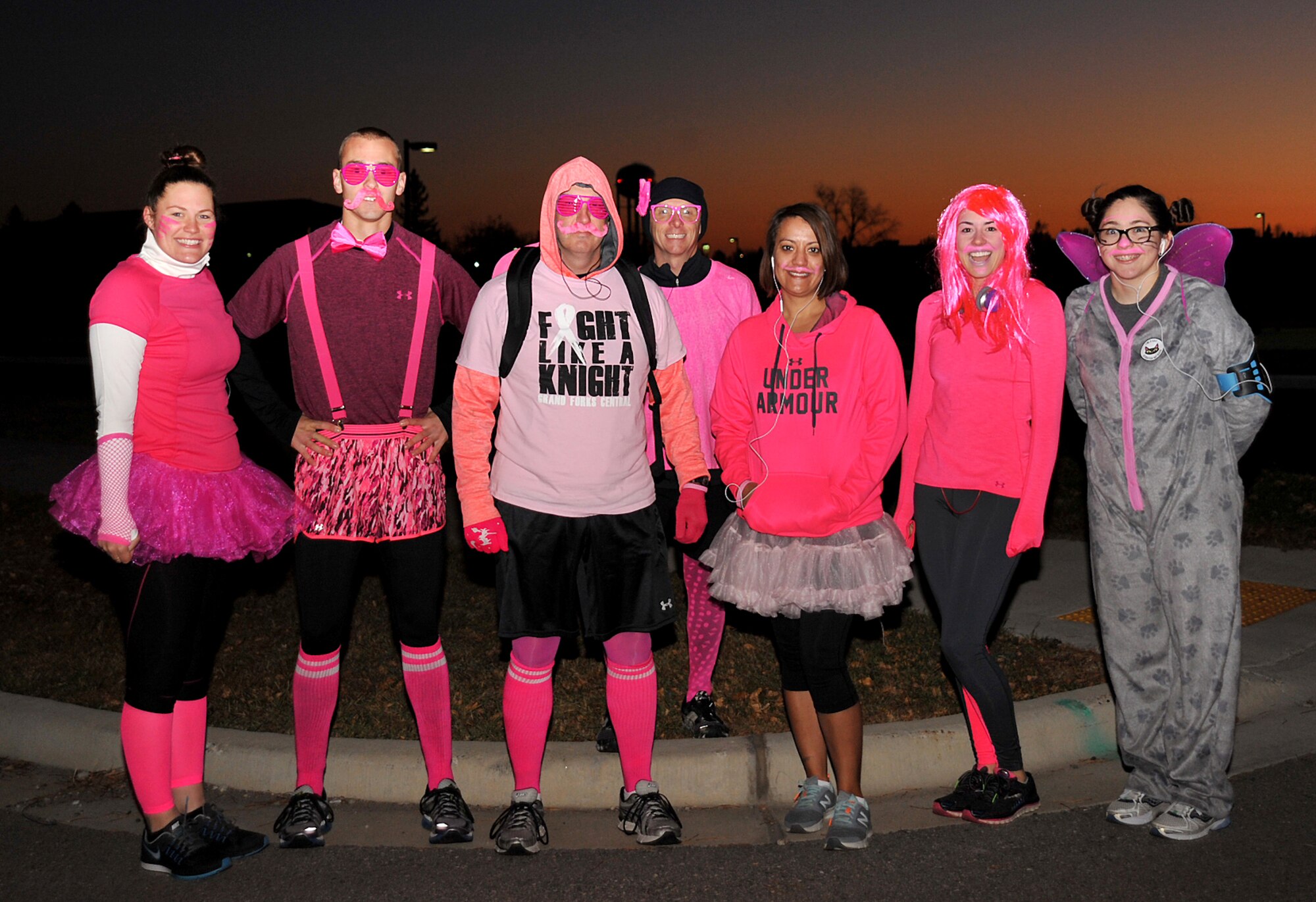 Members from the 319th Wing Staff Agencies and 319th Comptroller Squadron pose for a group photo at the Pink Run on Grand Forks Air Force Base, North Dakota, Oct. 22, 2015. The Pink Run was a 5K sponsored by the 319th Medical Group to promote breast cancer awareness. (U.S. Air Force photo/Airman 1st Class Bonnie Grantham/Released)