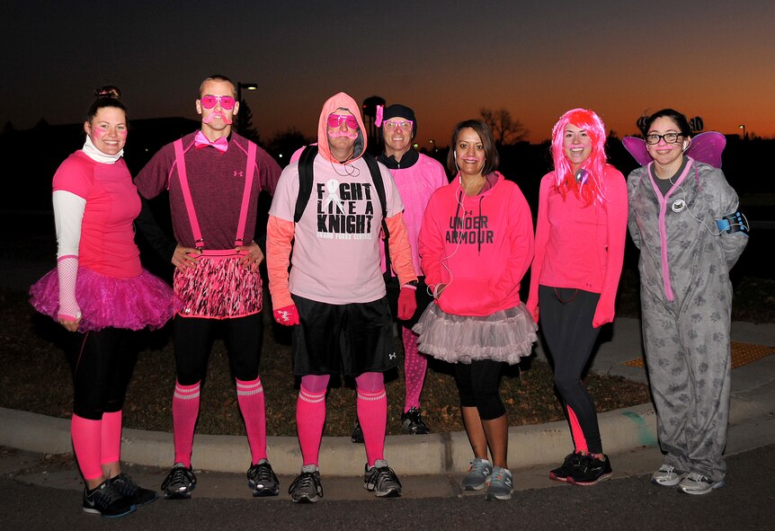Members from the 319th Wing Staff Agencies and 319th Comptroller Squadron pose for a group photo at the Pink Run on Grand Forks Air Force Base, North Dakota, Oct. 22, 2015. The Pink Run was a 5K sponsored by the 319th Medical Group to promote breast cancer awareness. (U.S. Air Force photo/Airman 1st Class Bonnie Grantham/Released)