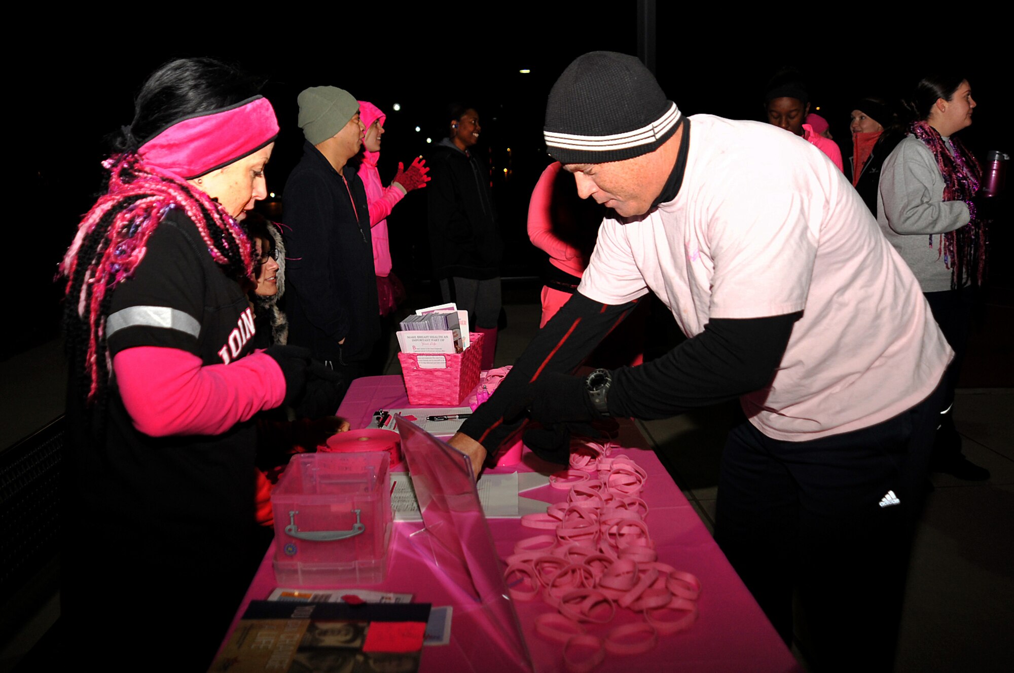 Maj. Scott Leblanc, 319th Medical Group, registers for the Pink Run on Grand Forks Air Force Base, North Dakota, Oct. 22, 2015. The Pink Run was an event sponsored by the 319th Medical Group to promote breast cancer awareness. (U.S. Air Force photo/Airman 1st Class Bonnie Grantham/Released)