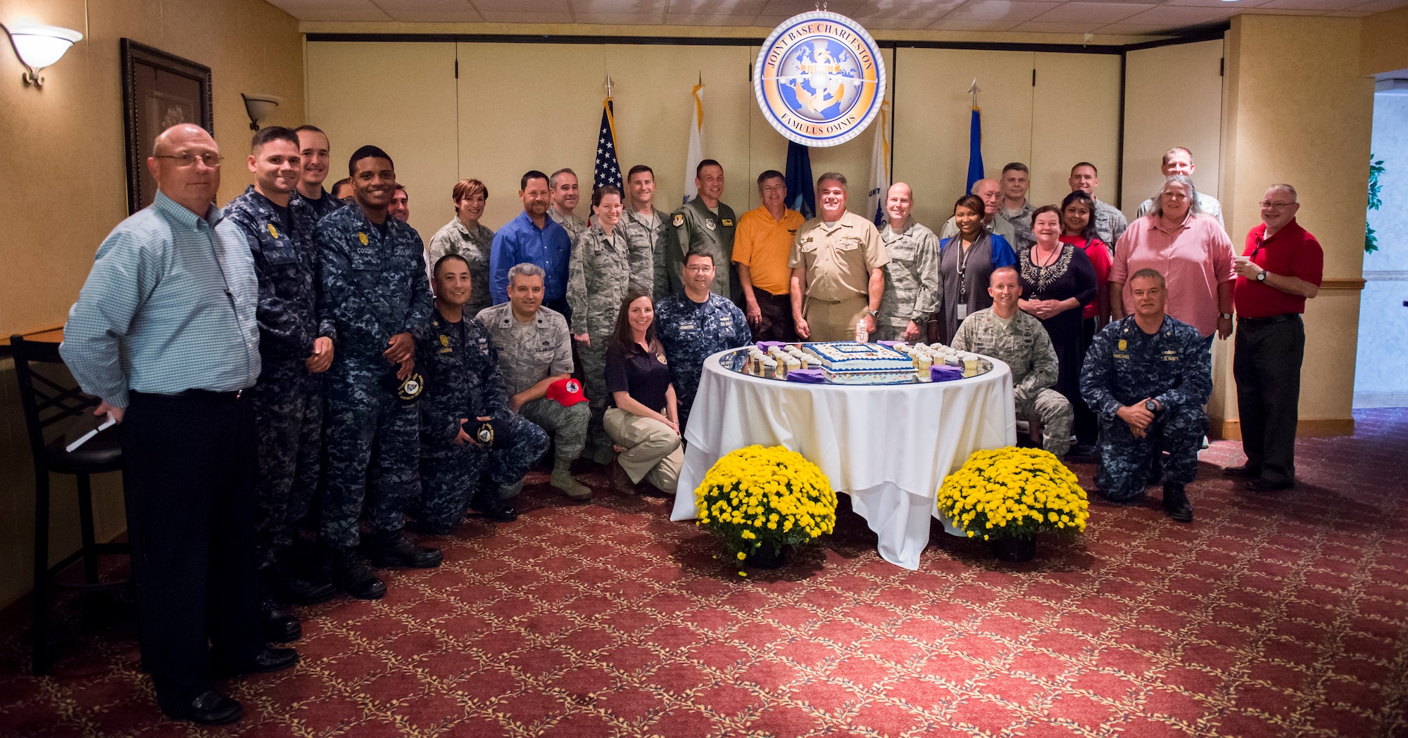 Joint Base Charleston leadership gathers for a group photo during the celebration of JB Charleston’s 5th birthday Oct. 22, 2015, at the Redbank Club on JB Charleston – Weapons Station, S.C. Charleston Air Force Base and Naval Support Activity Charleston merged on October 1, 2010, to form the current joint base operating configuration. (U.S. Air Force photo/Airman 1st Class Clayton Cupit)
