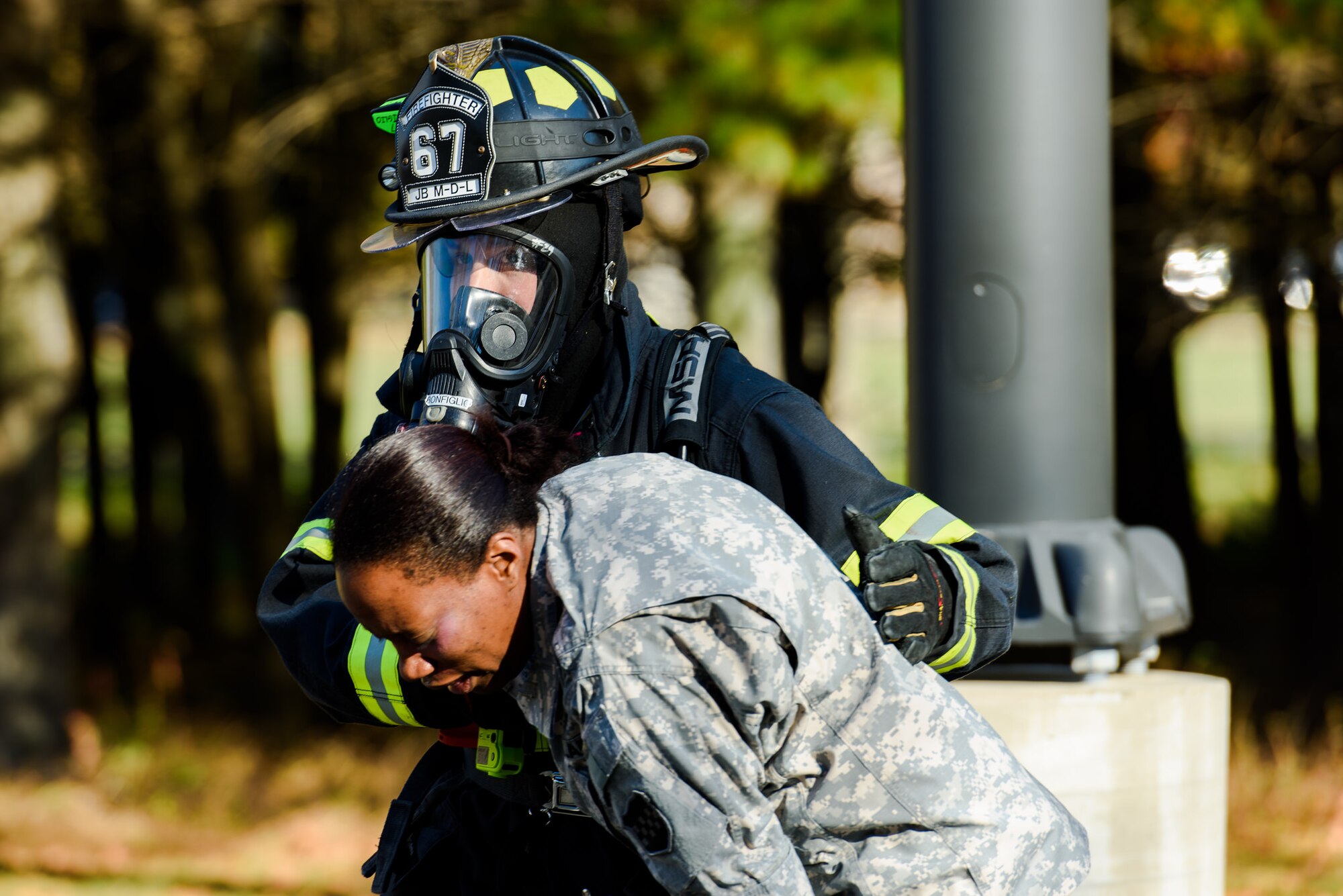 Emergency responders from Joint Base McGuire-Dix-Lakehurst react to a simulated chemical victim during a joint, multi-platform training exercise at JB MDL, N.J., Oct. 20, 2015. The exercise scenario simulated a chemical gas release to measure the responders’ ability to react and work together in the event of a crisis. (U.S. Air Force by Bob Williard /Released)