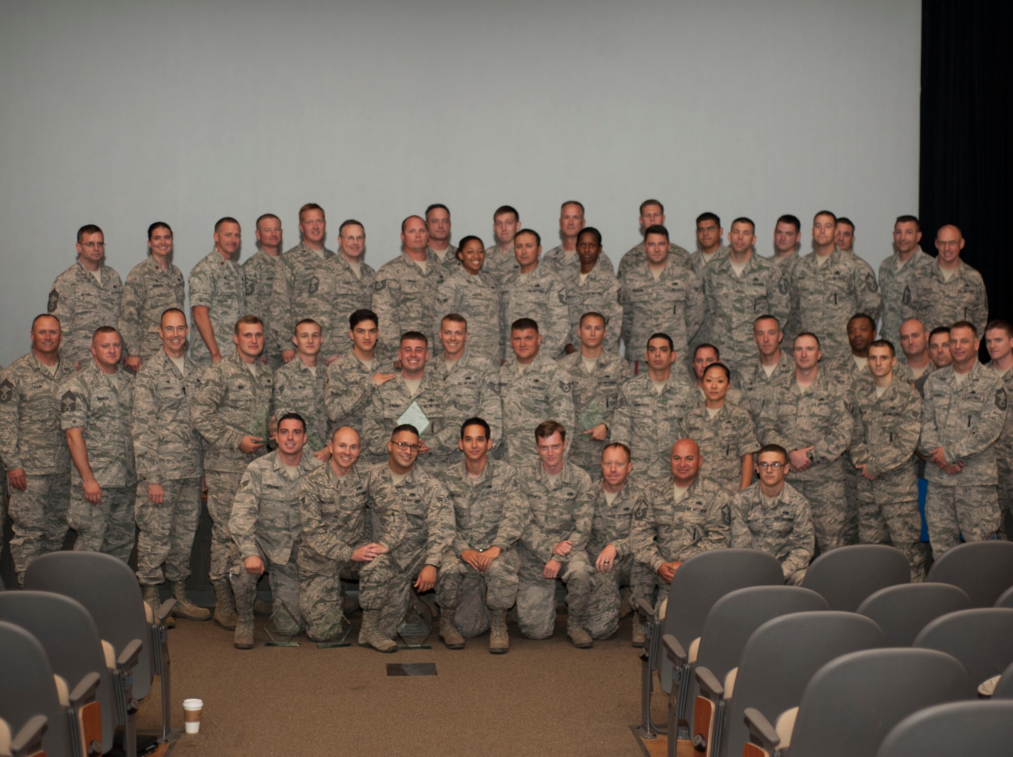U.S. Air Force Airmen from the 7th Munitions Squadron receive recognition for earning Global Strike Challenge’s Ellis Giant Sword on behalf of the 7th Bomb Wing Oct. 21, 2015, at Dyess Air Force Base, Texas. The award was presented to the 7th BW for overall best bomber maintenance, based on performance during bomber aircraft preflight, weapons build-up and weapons loading. (U.S. Air Force Photo by Airman First Class Katherine Miller/Released)