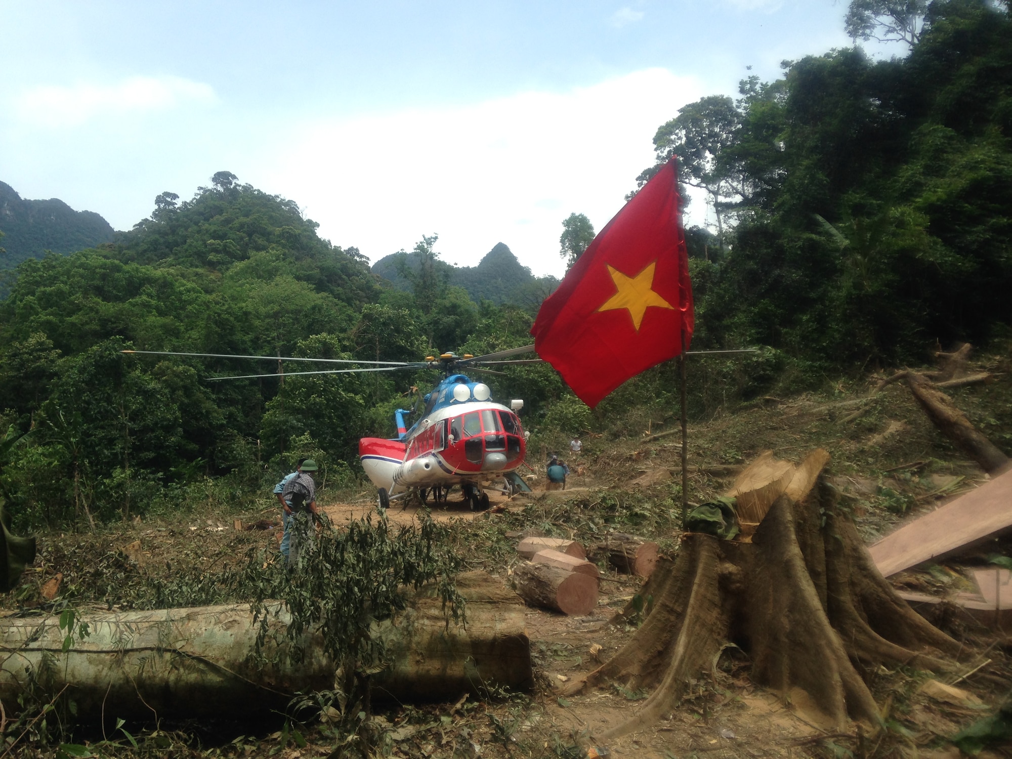 A Vietnamese helicopter in a jungle clearing, just after dropping off AFN's MC2(SW) Billy Ho on his mission to account for U.S. Service members currently listed as POW or MIA since the Vietnam War (DPAA Photo)
