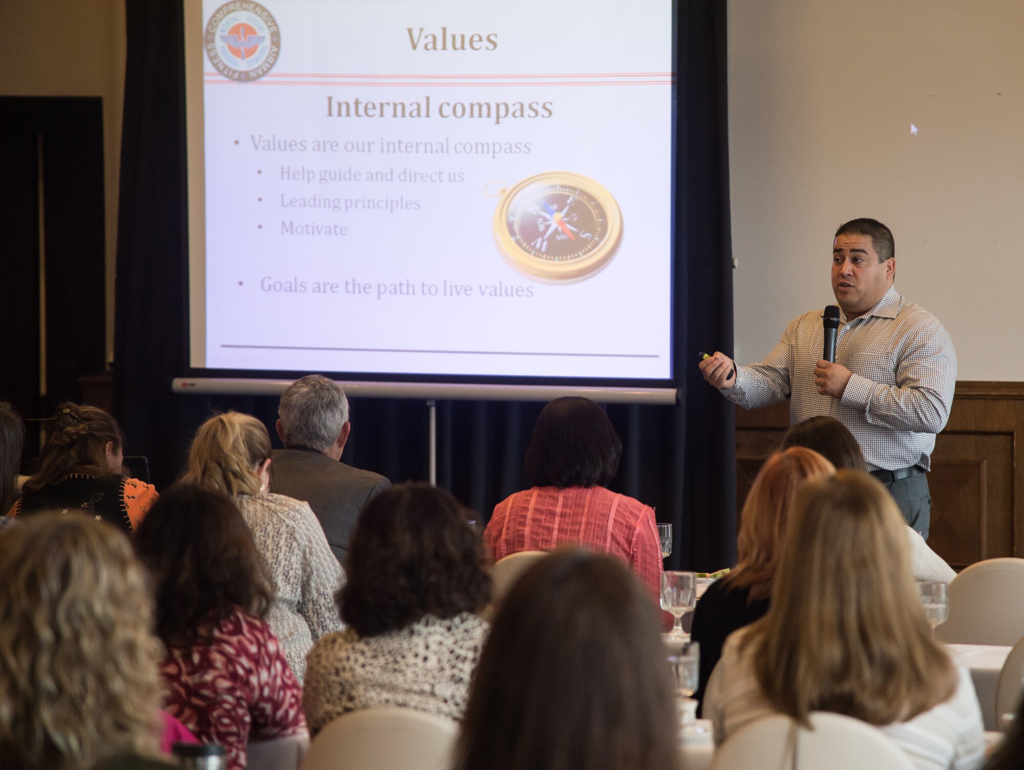 Cesar Alvarez, 86th Airlift Wing master resilience trainer, discusses how individual values play a role in accomplishing personal goals during resilience training for military spouses Oct. 6, 2015, at Ramstein Air Base, Germany. The event’s goal was to teach spouses Comprehensive Airman Fitness, the Air Force program that links resilience to maintaining mental, physical, social and spiritual fitness. (U.S. Air Force photo/ Senior Airman Jonathan Stefanko)