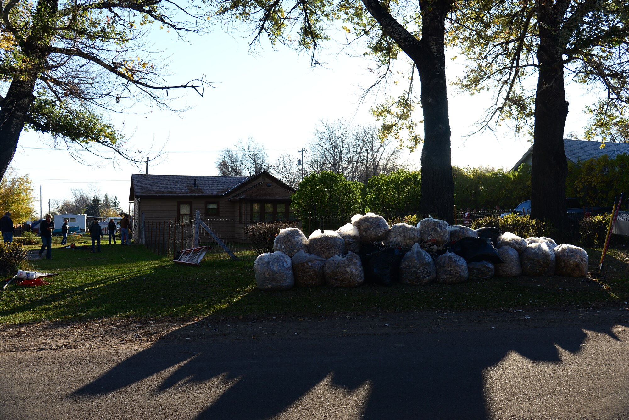 Collected leaves are stacked in a Great Falls, Mont. yard Oct. 23, 2015, as part of the Day of Caring. Airmen from Malmstrom Air Force Base and federal employees volunteered to perform household chores. (U.S. Air Force photo/Airman 1st Class Magen M. Reeves)