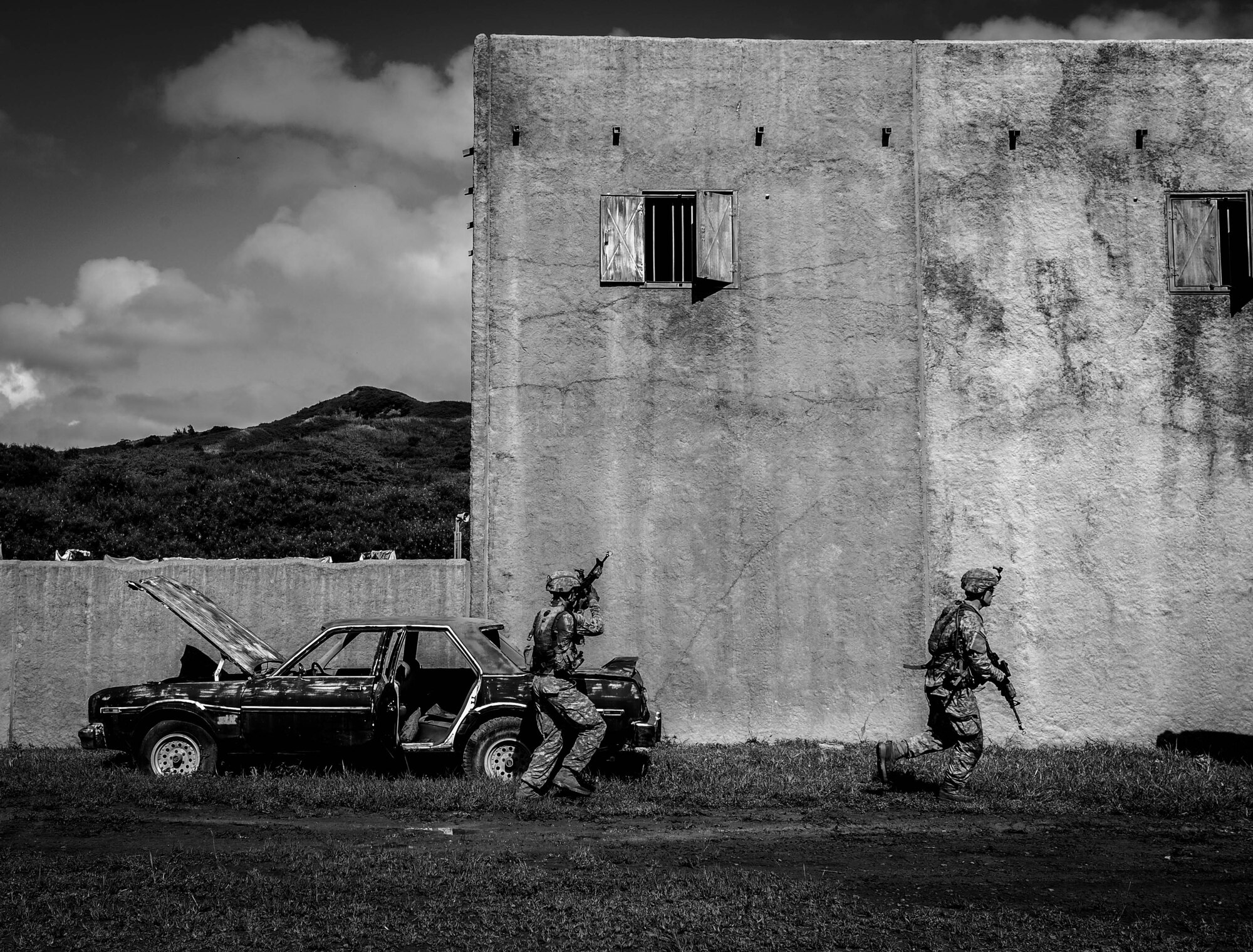 Soldiers from the U.S. Army 25th Infantry Division proceed down a training lane during a Field Training Exercise at Bellows Air Force Station, Hawaii, Oct. 22, 2015. The exercise was a combined training operation for Airmen from the 25th ASOS and Soldiers from the 25th ID to work in a simulated deployed environment. (U.S. Air Force photo by 2nd Lt. Kaitlin Daddona/Released)
