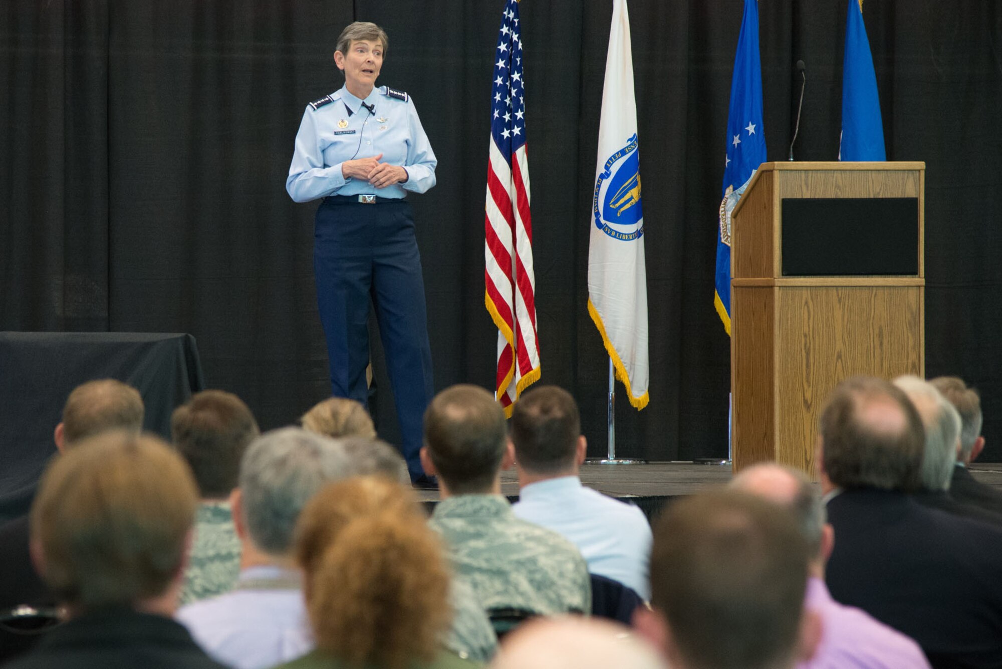 Members of the Hanscom workforce listen to Gen. Ellen M. Pawlikowski, commander of Air Force Materiel Command, discuss the importance of retaining a culture of respect and resiliency during a base-wide meeting at Hanscom AFB, Mass., Oct. 21. Other topics focused on strategic agility within the acquisition process and personnel issues. (U.S. Air Force photo by Mark Herlihy) 